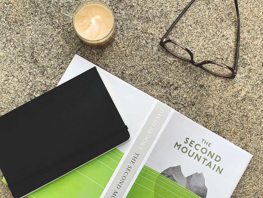 Books, glasses and a cup of coffee