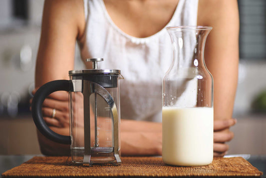 French press and milk bottle